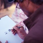 person sketching on a blank canvas, learning to draw
