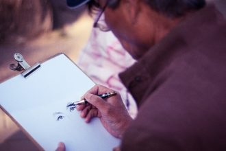person sketching on a blank canvas, learning to draw