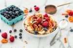 healthy breakfast with fruits, nuts, and a smoothie for moms