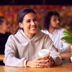 couple calmly talking and smiling, practicing healthy communication